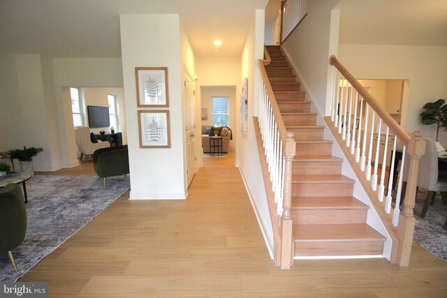 1609 Schwinn St, Middletown, DE 19709 - stairway featuring wood finished floors, a wealth of natural light, and baseboards