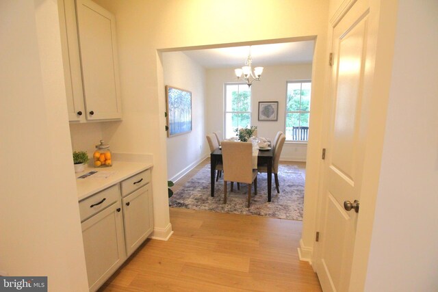 1609 Schwinn St, Middletown, DE 19709 - dining area with baseboards, a notable chandelier, and light wood-style floors