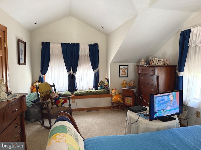 bedroom with carpet flooring, baseboards, and lofted ceiling