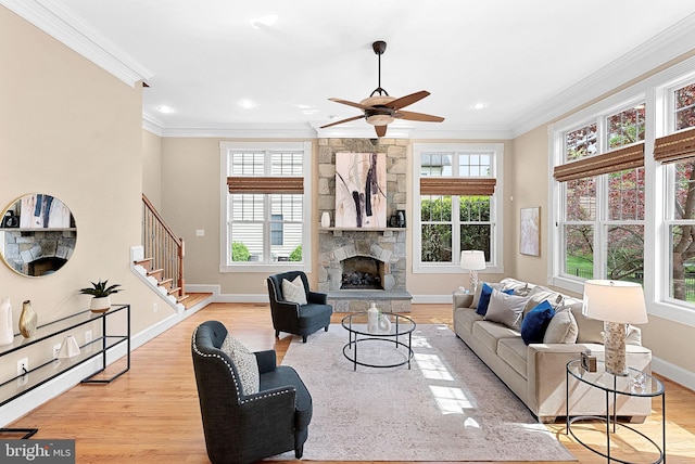 living area featuring ornamental molding and a wealth of natural light