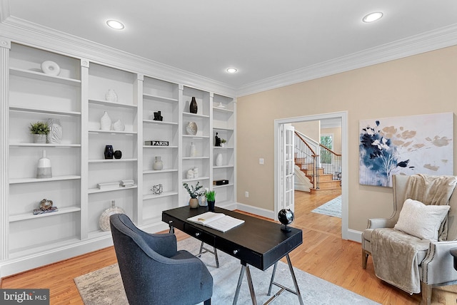 home office featuring recessed lighting, baseboards, ornamental molding, and light wood finished floors