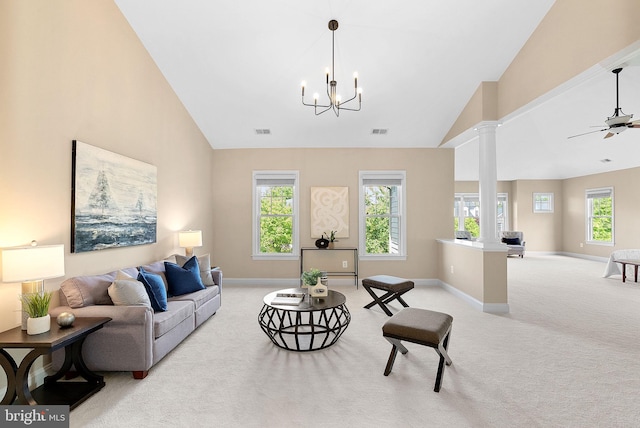 living room with baseboards, visible vents, decorative columns, and light colored carpet