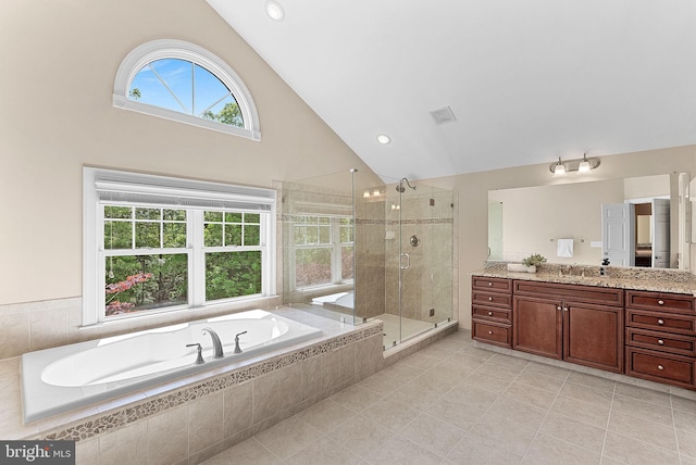 bathroom with vanity, tile patterned floors, visible vents, a bath, and a stall shower