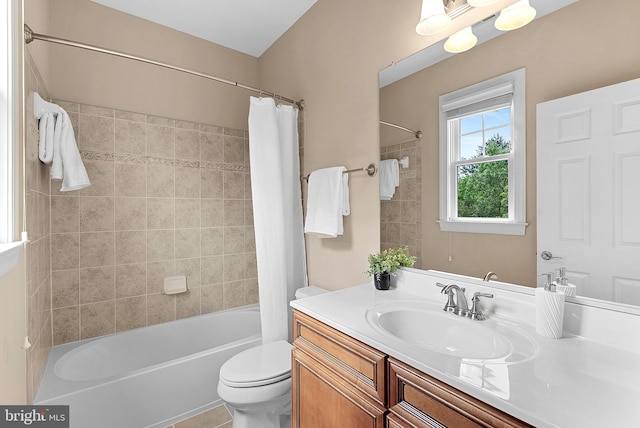 full bathroom featuring vanity, shower / bath combo with shower curtain, and toilet