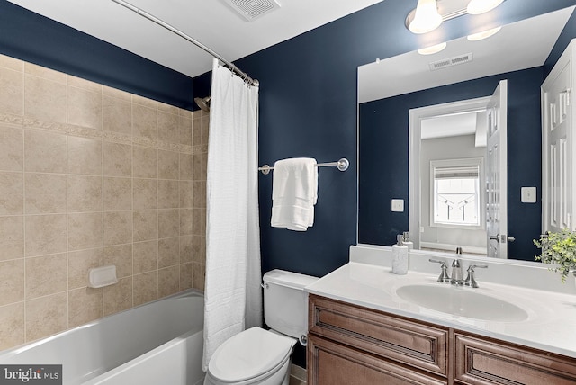 full bath featuring visible vents, shower / bath combination with curtain, toilet, and vanity