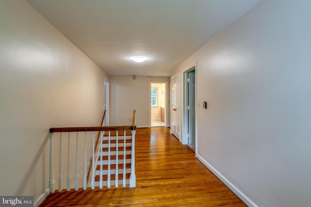 1428 Center Rd, Lancaster, PA 17603 - hall with an upstairs landing, wood finished floors, and baseboards