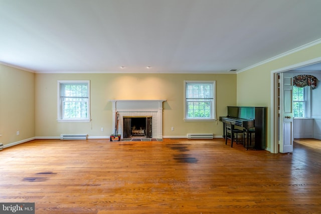 1428 Center Rd, Lancaster, PA 17603 - unfurnished living room with a baseboard radiator, healthy amount of natural light, wood finished floors, and crown molding