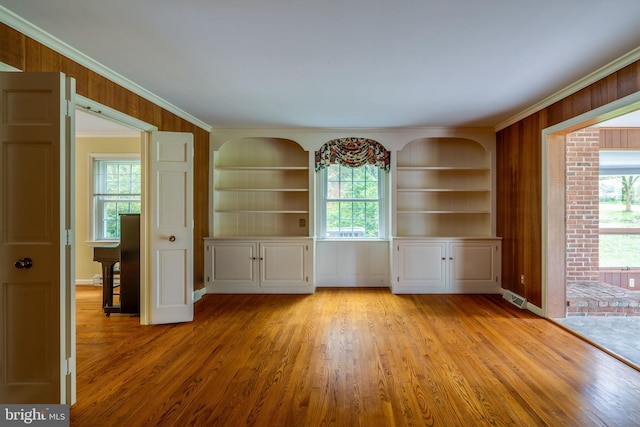 1428 Center Rd, Lancaster, PA 17603 - spare room with light wood-style flooring, crown molding, built in shelves, and baseboards