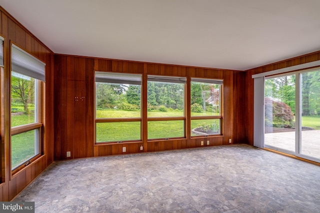 1428 Center Rd, Lancaster, PA 17603 - unfurnished sunroom with wood walls, plenty of natural light, and stone finish floors