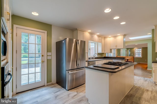 1428 Center Rd, Lancaster, PA 17603 - kitchen featuring stainless steel appliances, dark countertops, light wood-style flooring, white cabinetry, and recessed lighting