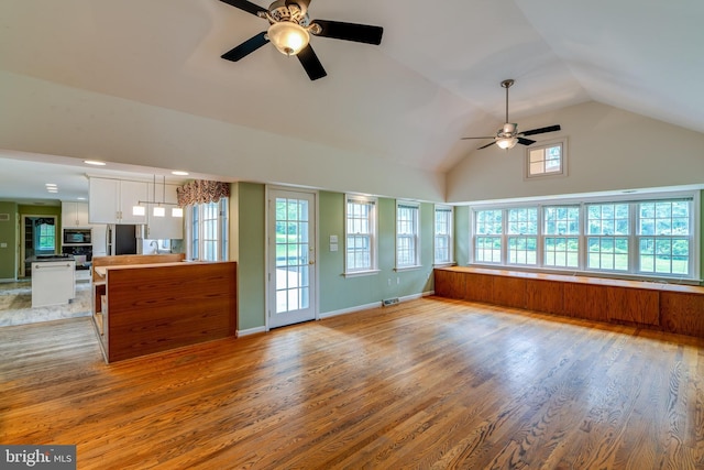 1428 Center Rd, Lancaster, PA 17603 - unfurnished living room with ceiling fan, light wood-style flooring, and high vaulted ceiling