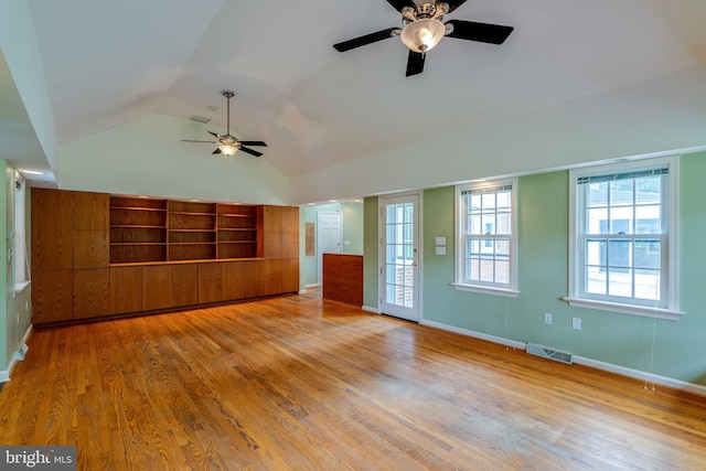 1428 Center Rd, Lancaster, PA 17603 - unfurnished living room featuring a ceiling fan, vaulted ceiling, wood finished floors, and baseboards