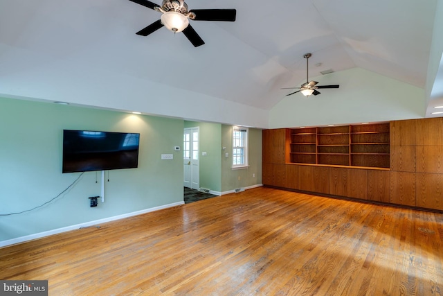 1428 Center Rd, Lancaster, PA 17603 - unfurnished living room with ceiling fan, wood finished floors, baseboards, and high vaulted ceiling
