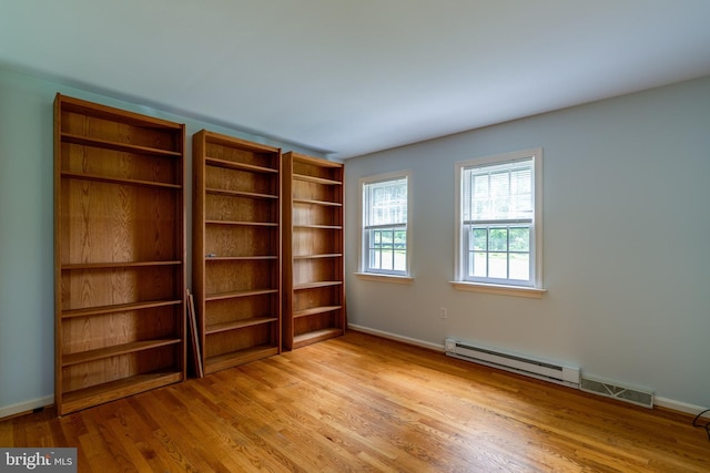 1428 Center Rd, Lancaster, PA 17603 - unfurnished room featuring wood finished floors, baseboards, and a baseboard heating unit