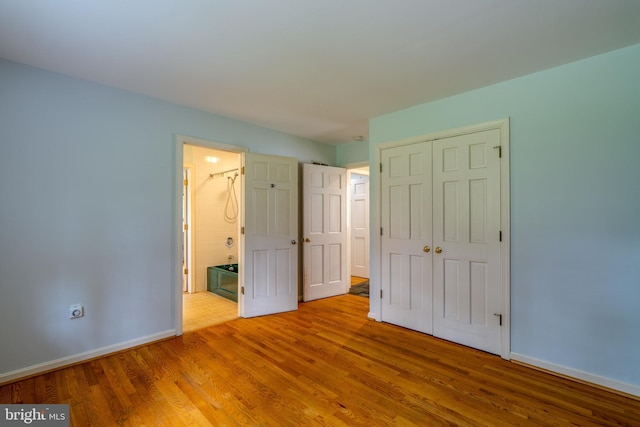 1428 Center Rd, Lancaster, PA 17603 - unfurnished bedroom with baseboards, wood finished floors, and a closet
