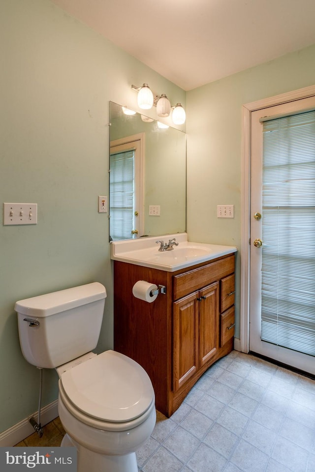 1428 Center Rd, Lancaster, PA 17603 - bathroom featuring vanity, toilet, and baseboards