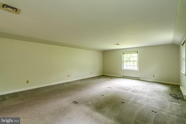 1428 Center Rd, Lancaster, PA 17603 - spare room featuring a baseboard heating unit, baseboards, carpet flooring, and vaulted ceiling