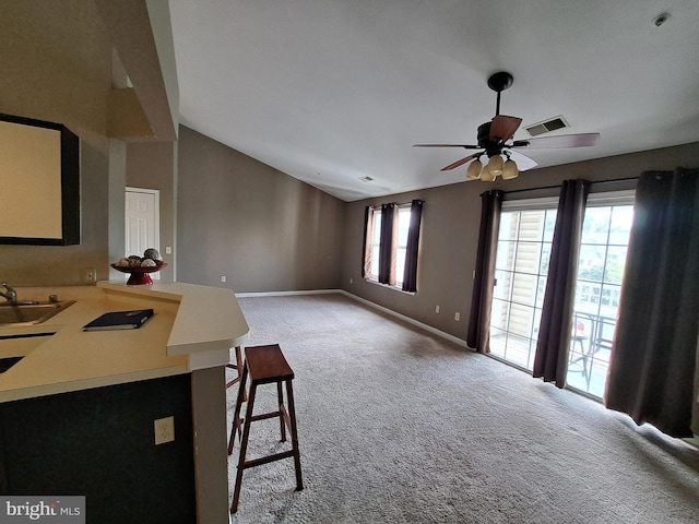 1310W Sheridan Pl Unit 301, Bel Air, MD 21015 - carpeted living room featuring vaulted ceiling, baseboards, a ceiling fan, and a sink