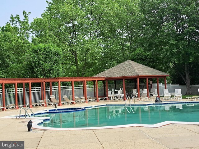1310W Sheridan Pl Unit 301, Bel Air, MD 21015 - community pool featuring a patio area, fence, a gazebo, and view of scattered trees