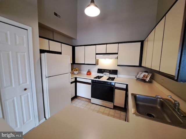 1310W Sheridan Pl Unit 301, Bel Air, MD 21015 - kitchen with white appliances, under cabinet range hood, light countertops, a sink, and light floors