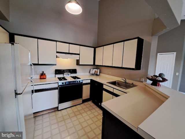 1310W Sheridan Pl Unit 301, Bel Air, MD 21015 - kitchen with gas stove, freestanding refrigerator, a sink, under cabinet range hood, and light floors
