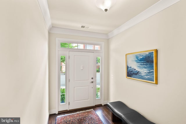 foyer entrance featuring visible vents and dark wood-type flooring