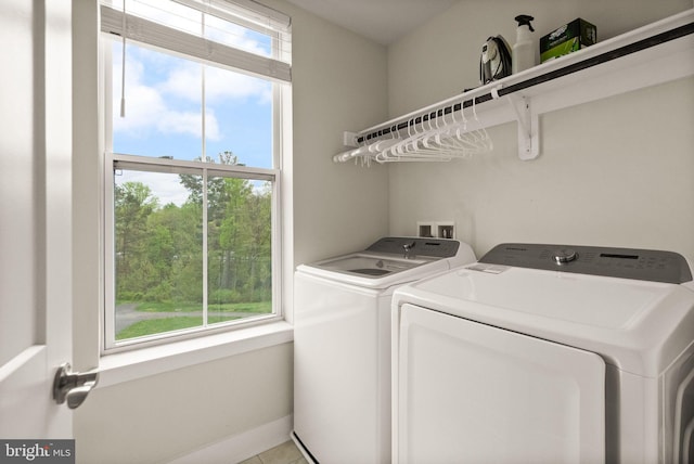 laundry room featuring washing machine and clothes dryer and laundry area