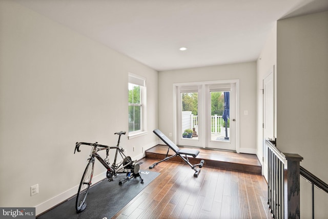 workout area with recessed lighting, baseboards, and hardwood / wood-style flooring