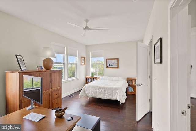 bedroom featuring baseboards, visible vents, dark wood-style floors, and ceiling fan