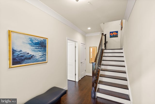 stairway featuring baseboards, ornamental molding, wood finished floors, and recessed lighting
