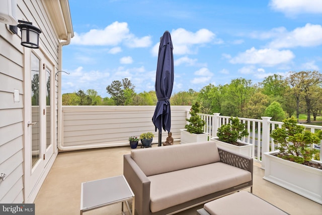 view of patio featuring an outdoor living space and a balcony