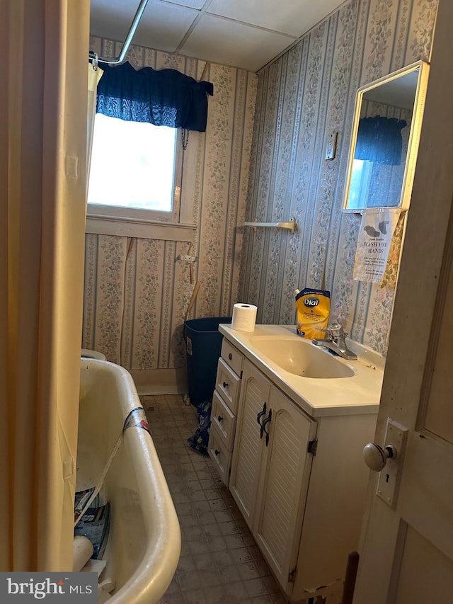 6573 Raystown Rd, Hopewell, PA 16650 - bathroom featuring a bath, vanity, and wallpapered walls