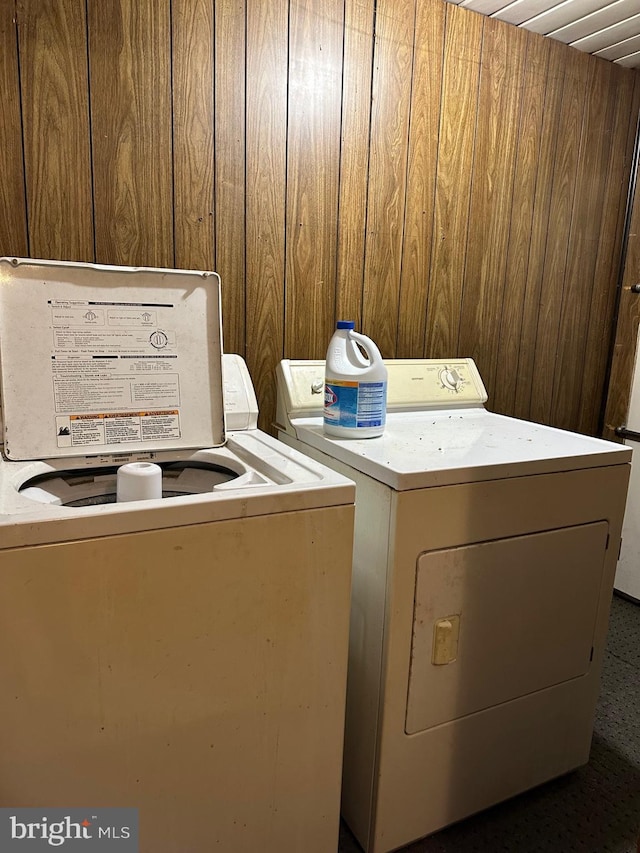 6573 Raystown Rd, Hopewell, PA 16650 - laundry area featuring laundry area, wooden walls, and washing machine and dryer