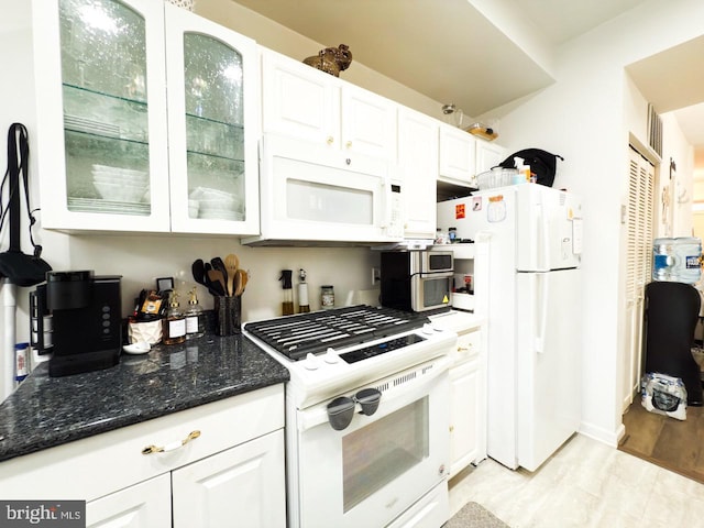 2030 4th St NW, Washington, DC 20001 - kitchen featuring glass insert cabinets, white cabinetry, white appliances, and dark stone counters