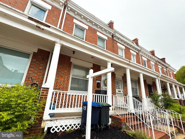 2030 4th St NW, Washington, DC 20001 - view of front facade with brick siding and a porch
