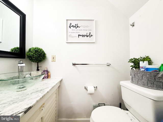 2030 4th St NW, Washington, DC 20001 - bathroom featuring vanity, baseboards, toilet, and lofted ceiling