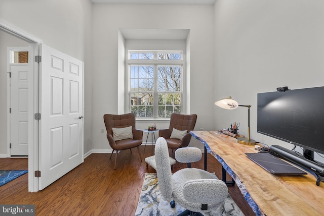office area with baseboards and wood finished floors