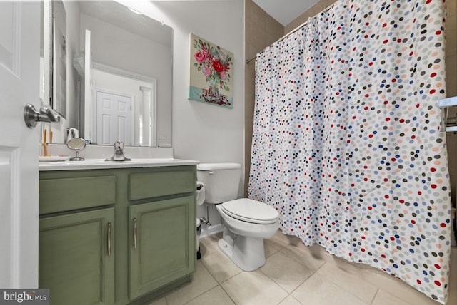 bathroom featuring toilet, tile patterned floors, vanity, and a shower with shower curtain