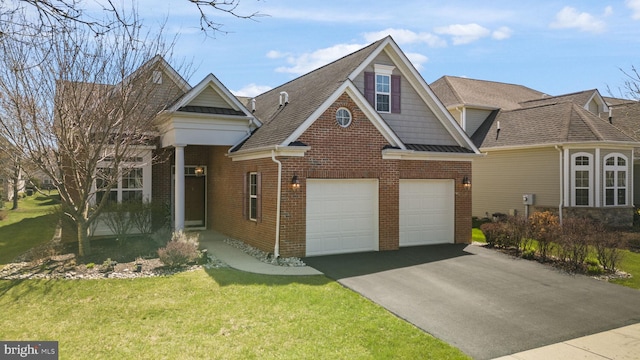 view of front of property with aphalt driveway, roof with shingles, a front lawn, brick siding, and an attached garage