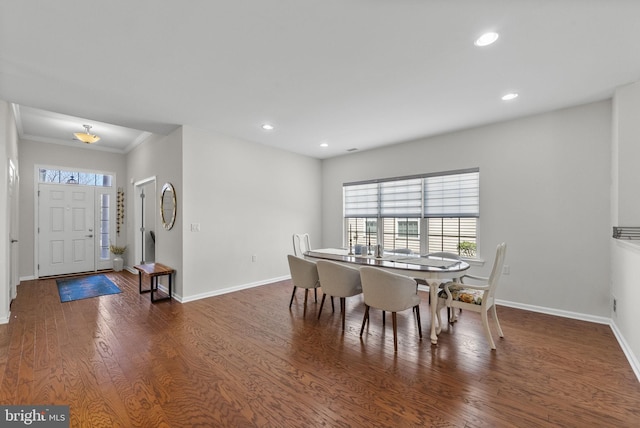 dining room featuring recessed lighting, baseboards, and wood finished floors