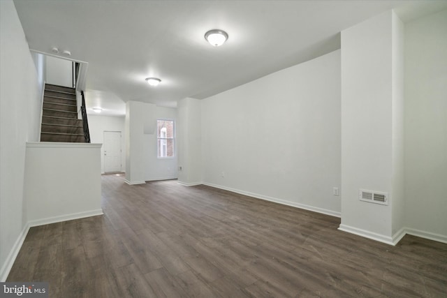 517 N 64th St, Philadelphia, PA 19151 - unfurnished room with dark wood-type flooring, visible vents, baseboards, and stairs