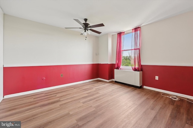 6100 Henry Ave Unit 7D, Philadelphia, PA 19128 - unfurnished room with radiator, ceiling fan, wood finished floors, and baseboards