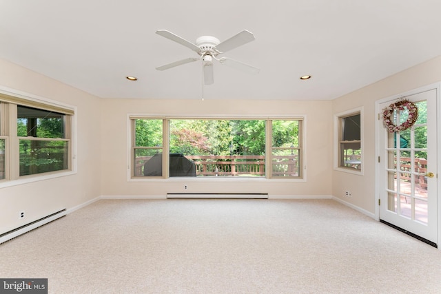 carpeted spare room featuring baseboards, a baseboard radiator, plenty of natural light, and recessed lighting