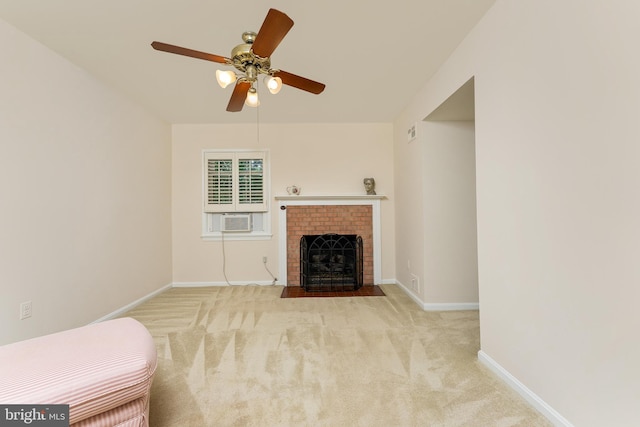 unfurnished living room featuring carpet floors, ceiling fan, baseboards, a fireplace, and cooling unit