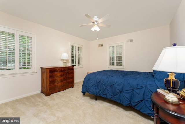bedroom featuring carpet, baseboards, and a ceiling fan