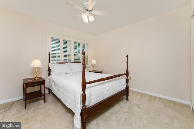 bedroom with baseboards, light carpet, and ceiling fan