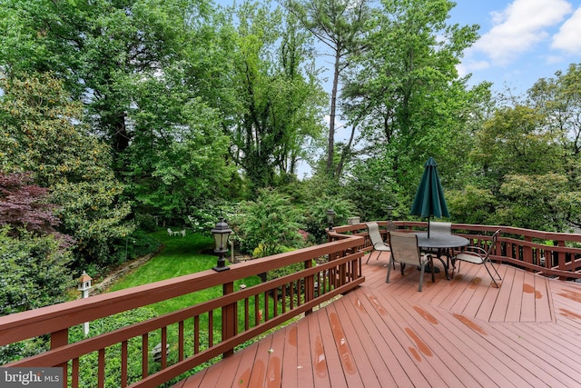 wooden deck with outdoor dining area