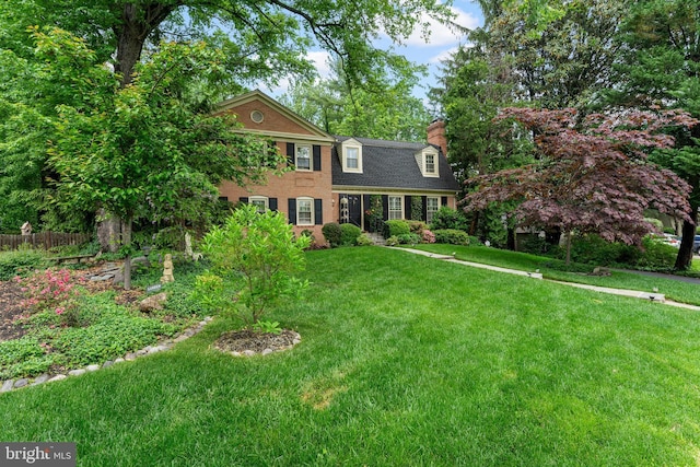 colonial house featuring a chimney