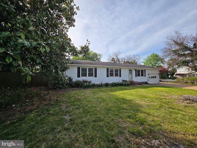 ranch-style home with concrete driveway, a garage, a front lawn, and fence