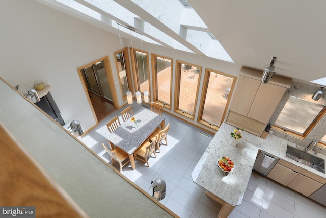 1023 Fairdell Dr, Hummelstown, PA 17036 - living area with tile patterned flooring, a towering ceiling, and a skylight